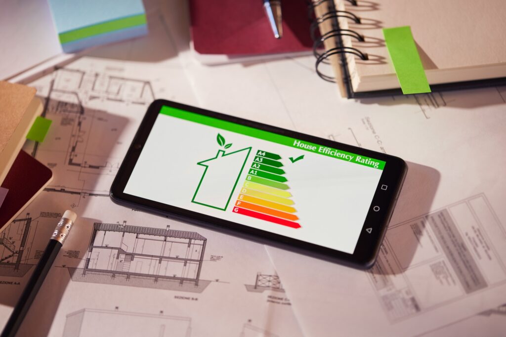 Tidworth EPC Certificates | energy-class-and-efficiency-app-on-phone-over-architectural-plans